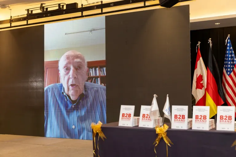 Prof. Philip Kotler delivering his live virtual keynote on screen