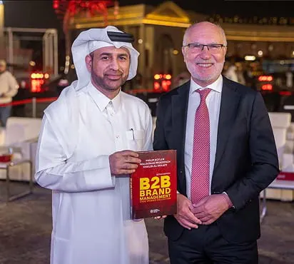 Dr. Khalid Al-Sulaiti and Dr. Waldemar Pfoertsch holding the Qatar Edition at the launch